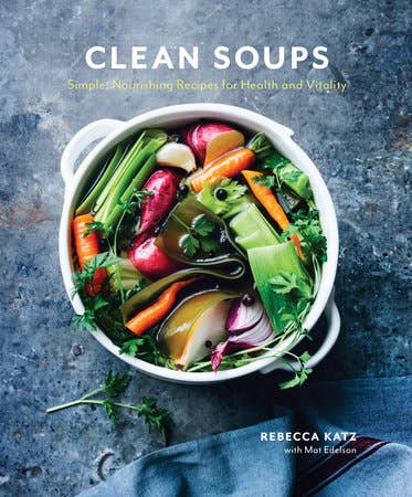 Book cover of 'Clean Soups' with a bowl of vegetables on a textured surface