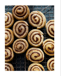 Babylonian swirls pastry on a cooling rack with recipe details on the right.