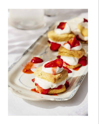Strawberry sweet corn shortcake on a plate with a recipe on the side.